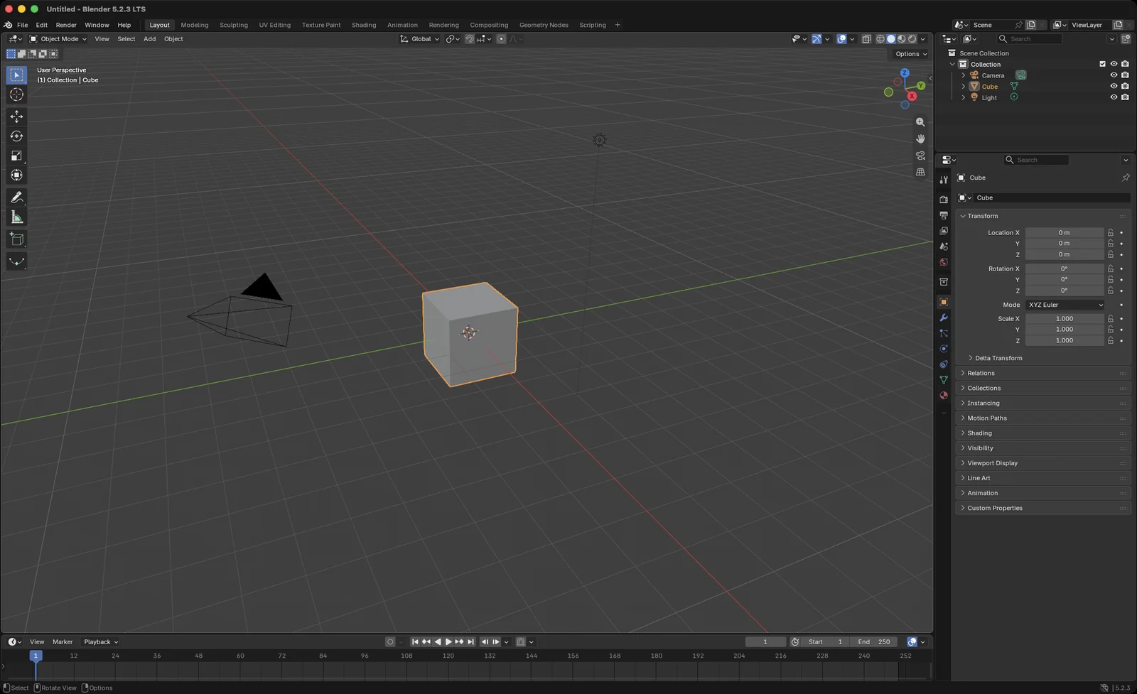 Blender on macOS with its default scene, a cube, a camera and a light, in the Layout workspace