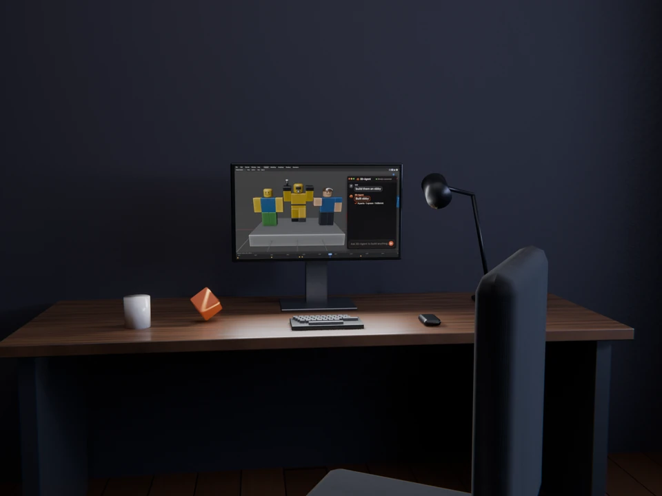 A desk in a dark room: a monitor showing three small characters, a desk lamp, a mug and a chair