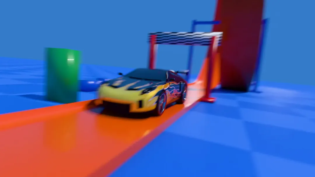 Five and a half seconds: the flames car runs down an orange toy track, slows over the top of the loop and comes out through a checkered gate, the camera flying around it